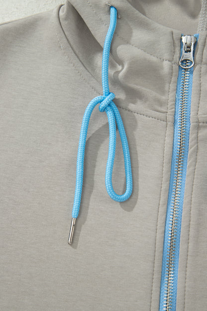 Ensemble 2 pièces jupe-short mini à cordon, veste zippée sport vert fumée à bord contrastant