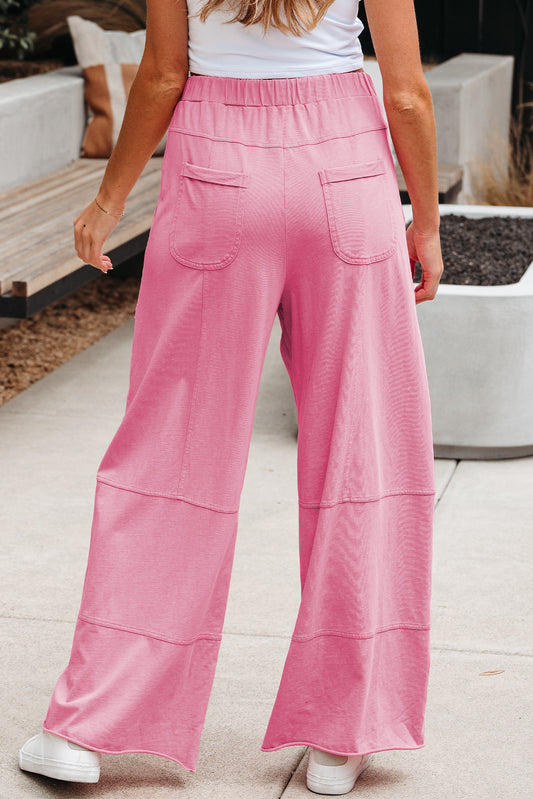 Pantalon cargo large en bonbon délavé avec coutures apparentes et taille élastique à cordon de serrage