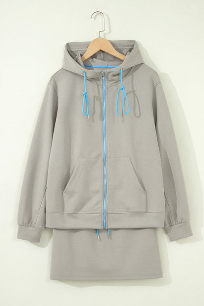 Ensemble 2 pièces jupe-short mini à cordon, veste zippée sport vert fumée à bord contrastant